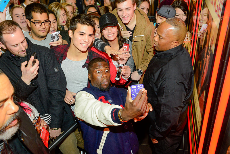 Kevin Hart snaps cellphone selfie photos with fans as he hosts a special screening of The Wedding Ringer at the University of Oregon on Nov. 15, 2014, in Eugene. Anthony Pidgeon/Getty Images for Screen Gems